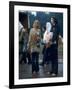 Couple Standing Barefoot on a Road Holding a Bundle and Wine Bottle, Woodstock Music and Art Fair-John Dominis-Framed Photographic Print