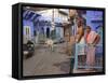 Couple Standing Outside Blue Painted Residential Haveli, Old City, Jodhpur, Rajasthan State, India-Eitan Simanor-Framed Stretched Canvas