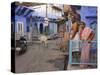 Couple Standing Outside Blue Painted Residential Haveli, Old City, Jodhpur, Rajasthan State, India-Eitan Simanor-Stretched Canvas