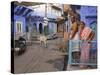 Couple Standing Outside Blue Painted Residential Haveli, Old City, Jodhpur, Rajasthan State, India-Eitan Simanor-Stretched Canvas