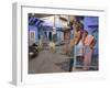 Couple Standing Outside Blue Painted Residential Haveli, Old City, Jodhpur, Rajasthan State, India-Eitan Simanor-Framed Photographic Print