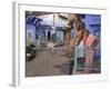 Couple Standing Outside Blue Painted Residential Haveli, Old City, Jodhpur, Rajasthan State, India-Eitan Simanor-Framed Photographic Print