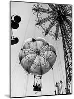 Couple Taking a Ride on the 300 Ft. Parachute Jump at Coney Island Amusement Park-Marie Hansen-Mounted Photographic Print