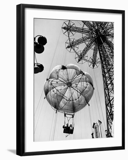 Couple Taking a Ride on the 300 Ft. Parachute Jump at Coney Island Amusement Park-Marie Hansen-Framed Photographic Print