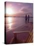 Couple Walking Along Beach at Sunset, Nassau, Bahamas, Caribbean-Greg Johnston-Stretched Canvas