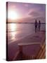 Couple Walking Along Beach at Sunset, Nassau, Bahamas, Caribbean-Greg Johnston-Stretched Canvas