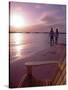 Couple Walking Along Beach at Sunset, Nassau, Bahamas, Caribbean-Greg Johnston-Stretched Canvas