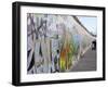 Couple Walking Along the East Side Gallery Berlin Wall Mural, Berlin, Germany, Europe-Simon Montgomery-Framed Photographic Print