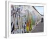 Couple Walking Along the East Side Gallery Berlin Wall Mural, Berlin, Germany, Europe-Simon Montgomery-Framed Photographic Print