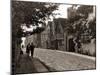 Couple Walking Down a Quiet Cobbled Road in Rye Sussex-null-Mounted Photographic Print