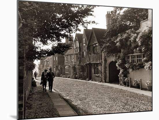 Couple Walking Down a Quiet Cobbled Road in Rye Sussex-null-Mounted Photographic Print