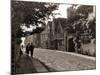 Couple Walking Down a Quiet Cobbled Road in Rye Sussex-null-Mounted Photographic Print