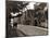 Couple Walking Down a Quiet Cobbled Road in Rye Sussex-null-Mounted Photographic Print