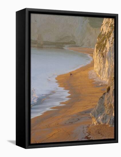 Couple Walking on Beach. Isle of Purbeck, Dorset, England UK-Jean Brooks-Framed Stretched Canvas