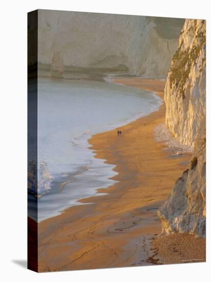 Couple Walking on Beach. Isle of Purbeck, Dorset, England UK-Jean Brooks-Stretched Canvas