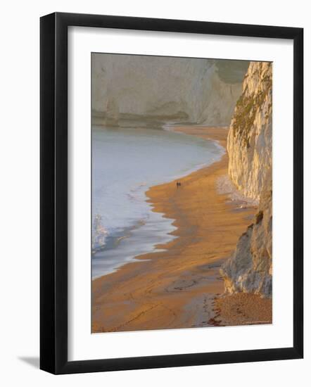 Couple Walking on Beach. Isle of Purbeck, Dorset, England UK-Jean Brooks-Framed Photographic Print