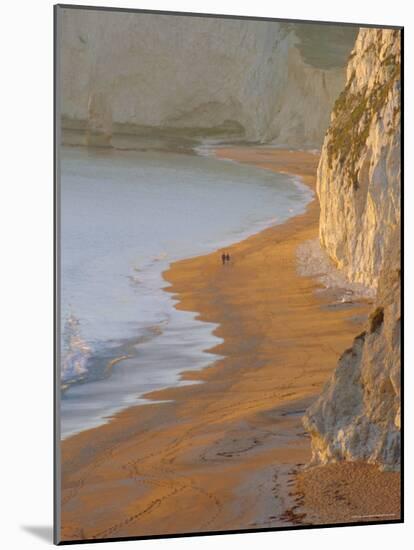 Couple Walking on Beach. Isle of Purbeck, Dorset, England UK-Jean Brooks-Mounted Photographic Print