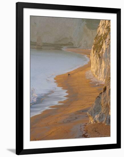 Couple Walking on Beach. Isle of Purbeck, Dorset, England UK-Jean Brooks-Framed Photographic Print