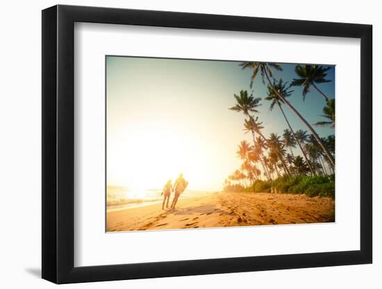 Couple Walking on the Sandy Beach with Palm Trees-Dudarev Mikhail-Framed Photographic Print