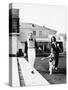 Couple Walking their St. Bernard Outside their Home-null-Stretched Canvas