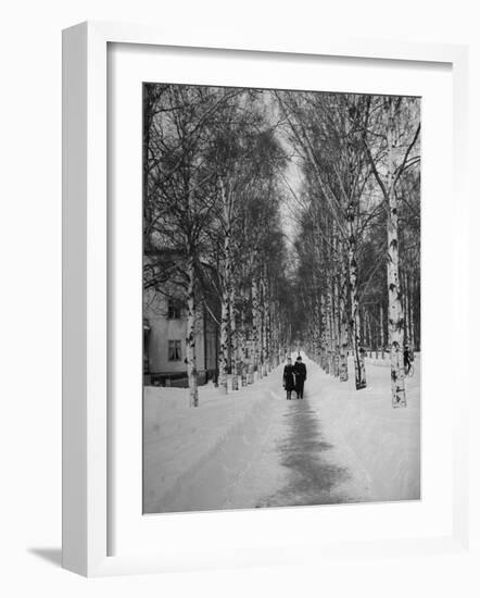 Couple Walking Through a Snow Covered Road-Carl Mydans-Framed Photographic Print