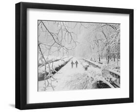 Couple Walking Through Park in Snow-Bettmann-Framed Photographic Print