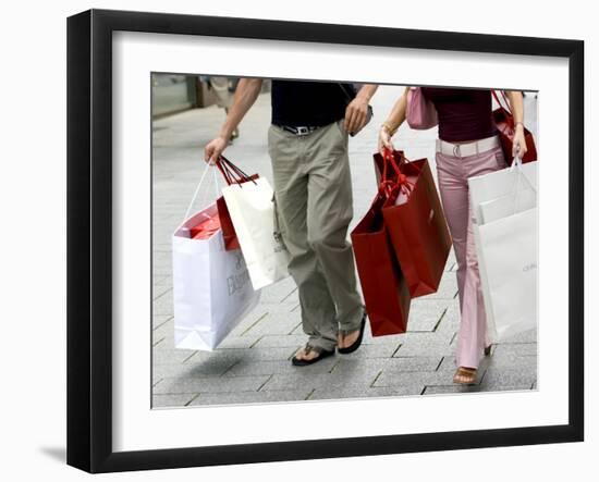 Couple Walking with Shopping Bags on Konigsallee, Dusseldorf, North Rhine Westphalia, Germany-Yadid Levy-Framed Photographic Print