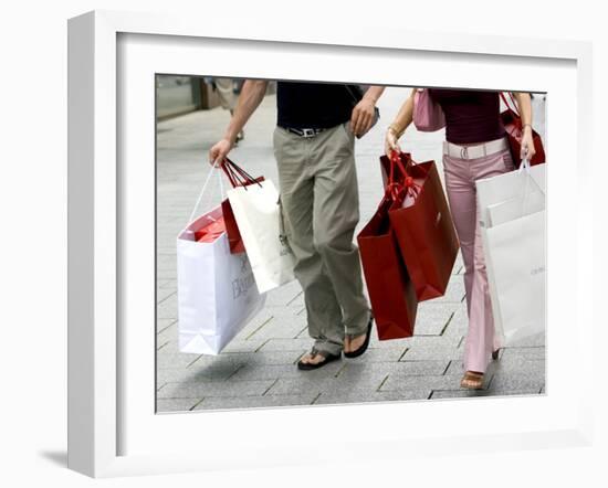 Couple Walking with Shopping Bags on Konigsallee, Dusseldorf, North Rhine Westphalia, Germany-Yadid Levy-Framed Photographic Print