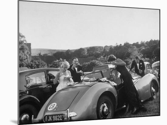 Couples Enjoying Food During Intermission of the Opera at the Glyndebourne Festival-Cornell Capa-Mounted Photographic Print