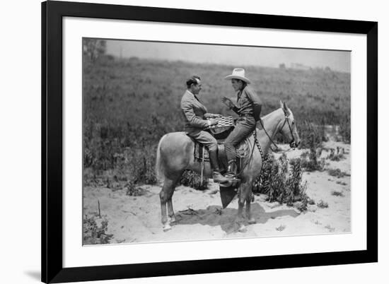 Cowboy and Businessman Playing Checkers on Horseback-null-Framed Photo