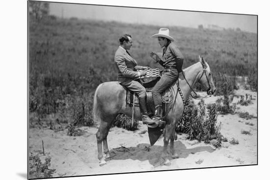 Cowboy and Businessman Playing Checkers on Horseback-null-Mounted Photo