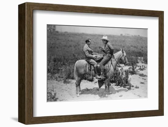 Cowboy and Businessman Playing Checkers on Horseback-null-Framed Photo