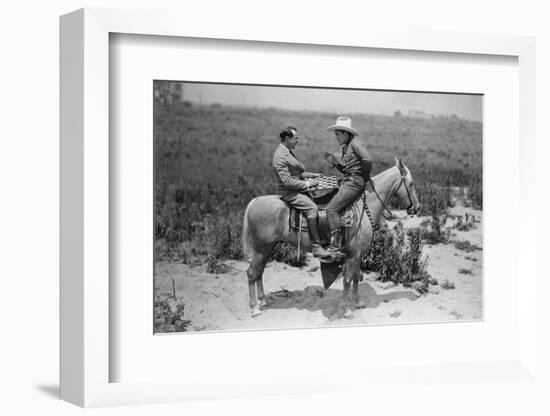 Cowboy and Businessman Playing Checkers on Horseback-null-Framed Photo