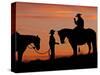 Cowboy and Cowgirl Silhouetted on a Ridge in the Big Horn Mountains, Wyoming, USA-Joe Restuccia III-Stretched Canvas