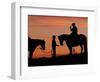 Cowboy and Cowgirl Silhouetted on a Ridge in the Big Horn Mountains, Wyoming, USA-Joe Restuccia III-Framed Photographic Print