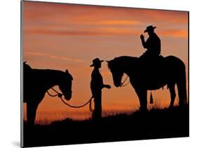 Cowboy and Cowgirl Silhouetted on a Ridge in the Big Horn Mountains, Wyoming, USA-Joe Restuccia III-Mounted Photographic Print