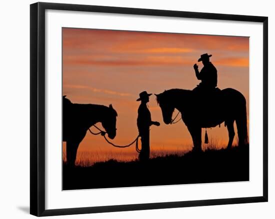 Cowboy and Cowgirl Silhouetted on a Ridge in the Big Horn Mountains, Wyoming, USA-Joe Restuccia III-Framed Photographic Print