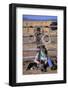 Cowboy and Dog Sitting Against Fence-Darrell Gulin-Framed Photographic Print