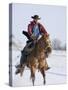 Cowboy Cantering Through Snow on Chestnut Red Dun Quarter Horse Gelding, Berthoud, Colorado, USA-Carol Walker-Stretched Canvas