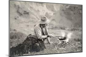 Cowboy Cooking over Campfire-null-Mounted Art Print