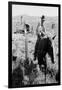 Cowboy Holds His Baby While Riding a Horse-Dorothea Lange-Framed Art Print