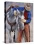 Cowboy Leading and Stroking His Horse, Flitner Ranch, Shell, Wyoming, USA-Carol Walker-Stretched Canvas