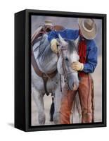 Cowboy Leading and Stroking His Horse, Flitner Ranch, Shell, Wyoming, USA-Carol Walker-Framed Stretched Canvas