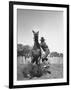 Cowboy Mounting a Horse-Carl Mydans-Framed Premium Photographic Print