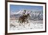 Cowboy On Grey Quarter Horse Trotting In The Snow At Flitner Ranch, Shell, Wyoming-Carol Walker-Framed Photographic Print