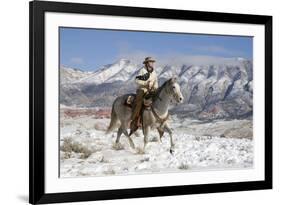 Cowboy On Grey Quarter Horse Trotting In The Snow At Flitner Ranch, Shell, Wyoming-Carol Walker-Framed Photographic Print