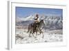 Cowboy On Grey Quarter Horse Trotting In The Snow At Flitner Ranch, Shell, Wyoming-Carol Walker-Framed Photographic Print