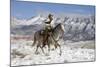 Cowboy On Grey Quarter Horse Trotting In The Snow At Flitner Ranch, Shell, Wyoming-Carol Walker-Mounted Photographic Print