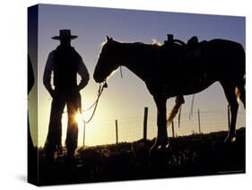 Cowboy on Horseback, Ponderosa Ranch, Seneca, Oregon, USA-Darrell Gulin-Stretched Canvas