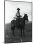 Cowboy on Horseback with Rifle-null-Mounted Photographic Print